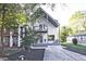 Modern two-story home with a grey trim, inviting front porch, and landscaped front yard at 179 South Se Ave, Atlanta, GA 30315