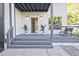 Inviting front porch with grey wood and modern design elements at 179 South Se Ave, Atlanta, GA 30315