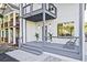 Stylish front porch with grey wood, seating, and modern lighting at 179 South Se Ave, Atlanta, GA 30315