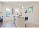 Bright kitchen featuring stainless steel appliances, white cabinets and an island with counter seating at 179 South Se Ave, Atlanta, GA 30315