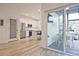 Bright, modern kitchen with stainless steel appliances, white cabinets, and an adjacent patio at 179 South Se Ave, Atlanta, GA 30315