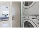 Convenient laundry area with a stackable washer and dryer, located near the bedroom at 179 South Se Ave, Atlanta, GA 30315