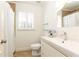 Bright bathroom featuring a white sink vanity, window with shutters, and shower with a patterned curtain at 3034 Farmington Se Dr, Atlanta, GA 30339