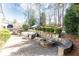 Outdoor patio space featuring comfortable seating area, outdoor fire pit, and mature landscaping at 3034 Farmington Se Dr, Atlanta, GA 30339