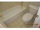 A bathroom with a toilet and tub at 3975 Broadleaf Walk, Ellenwood, GA 30294