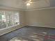 A bedroom featuring a tray ceiling and carpeted floors at 3975 Broadleaf Walk, Ellenwood, GA 30294