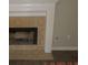 Corner shot of the fireplace with tile surround and a white mantle at 3975 Broadleaf Walk, Ellenwood, GA 30294