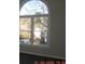 Large window with view of treed backyard at 3975 Broadleaf Walk, Ellenwood, GA 30294