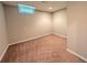 Finished basement space with a small window and neutral paint at 8271 Walnut Dr, Jonesboro, GA 30238