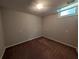 Finished basement space with a small window and neutral paint at 8271 Walnut Dr, Jonesboro, GA 30238