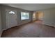 Inviting living room with neutral paint, carpet flooring and ample natural light at 8271 Walnut Dr, Jonesboro, GA 30238