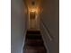 Carpeted staircase leading to the upper level of the home at 8271 Walnut Dr, Jonesboro, GA 30238