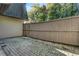 View of the backyard's stone paver patio and wooden fence at 9 Ivy Gates Ne, Atlanta, GA 30342