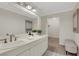 This bathroom features a large mirror, vanity with a sink, and a walk-in closet at 9 Ivy Gates Ne, Atlanta, GA 30342