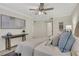 The main bedroom features a contemporary ceiling fan, console table, and modern decor at 9 Ivy Gates Ne, Atlanta, GA 30342