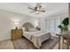 A view of the bedroom featuring an upholstered headboard, vintage rug, and neutral decor at 9 Ivy Gates Ne, Atlanta, GA 30342