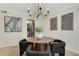 Dining room featuring a chandelier, table, with kitchen views at 9 Ivy Gates Ne, Atlanta, GA 30342