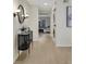 Hallway featuring a console table and lighting, with access to the main living space at 9 Ivy Gates Ne, Atlanta, GA 30342