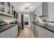 Galley kitchen showcasing stainless steel appliances and ample cabinet space at 9 Ivy Gates Ne, Atlanta, GA 30342