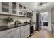 Modern kitchen with stainless steel appliances, subway tile backsplash, and black countertops at 9 Ivy Gates Ne, Atlanta, GA 30342