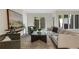 Sunlit living room featuring stylish furnishings, a sliding glass door, and neutral decor at 9 Ivy Gates Ne, Atlanta, GA 30342