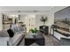 Bright living room with modern furnishings and decor open to the kitchen at 9 Ivy Gates Ne, Atlanta, GA 30342