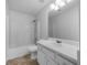 Clean bathroom featuring a shower and tub combination, toilet, sink, and vanity offering essential amenities at 1486 Waterton Trl, Douglasville, GA 30134