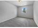 Cozy bedroom with soft carpeting and a window that lets in natural light at 1486 Waterton Trl, Douglasville, GA 30134