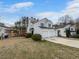 Suburban home with a two-car garage and well-maintained lawn in a residential neighborhood at 1486 Waterton Trl, Douglasville, GA 30134