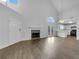 Bright and airy living room with fireplace, vaulted ceiling, and hardwood floors, offering a modern living space at 1486 Waterton Trl, Douglasville, GA 30134