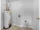 Utility room featuring a water heater and washer/dryer hookups at 1486 Waterton Trl, Douglasville, GA 30134