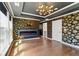 A light-filled bedroom showcases a fireplace, tray ceiling, unique wallpaper and hardwood floors at 2125 Burnside Nw Dr, Atlanta, GA 30318