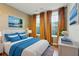 Bright bedroom featuring a comfortable bed, colorful decor, and natural light at 2125 Burnside Nw Dr, Atlanta, GA 30318