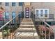 Inviting home entrance up a stone staircase with black railings and a modern door at 2125 Burnside Nw Dr, Atlanta, GA 30318