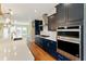 Close up of gourmet kitchen featuring quartz countertops, stainless appliances, and modern lighting at 2125 Burnside Nw Dr, Atlanta, GA 30318