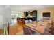 Open-concept kitchen boasts a center island with breakfast bar, modern appliances, and adjacent dining area at 2125 Burnside Nw Dr, Atlanta, GA 30318