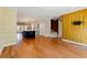 Spacious living room with open floor plan, stylish wallpaper, hardwood floors, and natural light at 2125 Burnside Nw Dr, Atlanta, GA 30318