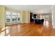 Open-concept living space with large windows, hardwood floors, and modern lighting at 2125 Burnside Nw Dr, Atlanta, GA 30318