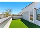 Rooftop patio offers outdoor area with artificial turf and skyline views at 2125 Burnside Nw Dr, Atlanta, GA 30318