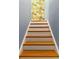 Stairway with finished wooden steps, white risers and light-blue painted wall at 2125 Burnside Nw Dr, Atlanta, GA 30318