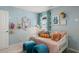 Bright bedroom features playful decorations, comfortable seating, and cozy bedding at 2493 Cotton Ln, Douglasville, GA 30135