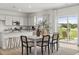 Open-concept dining area with modern table set and sliding glass doors at 2493 Cotton Ln, Douglasville, GA 30135