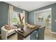 Stylish home office with large window, plenty of light, chairs, and a desk perfect for working from home at 2493 Cotton Ln, Douglasville, GA 30135