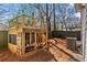 Backyard with a custom-built playset, providing a fun and engaging space for children to play at 305 Norwood Ne Ave, Atlanta, GA 30317