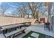 Inviting backyard with a dining table, seating area, grill, and storage shed, ideal for outdoor gatherings at 305 Norwood Ne Ave, Atlanta, GA 30317