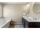 Well-lit bathroom boasts double sinks, undermount cabinet, and bathtub for a luxurious experience at 305 Norwood Ne Ave, Atlanta, GA 30317