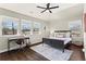 Bedroom features natural light, ceiling fan, and hard wood floors for a comfortable living space at 305 Norwood Ne Ave, Atlanta, GA 30317