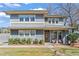 Charming two-story home with a front porch and landscaped yard offers a welcoming curb appeal at 305 Norwood Ne Ave, Atlanta, GA 30317