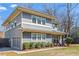 Well-maintained two-story home with a detached garage, attractive landscaping and inviting front porch at 305 Norwood Ne Ave, Atlanta, GA 30317