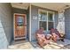 Cozy front porch with seating offers a relaxing outdoor space to enjoy a morning coffee or an evening sunset at 305 Norwood Ne Ave, Atlanta, GA 30317